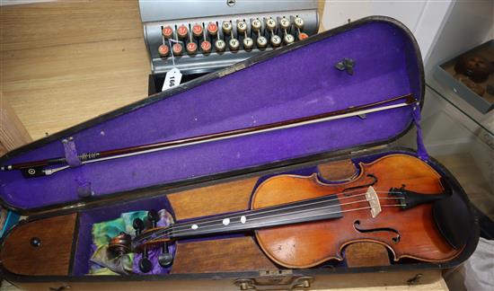 A German early 20th century violin and bow in a walnut inlaid case